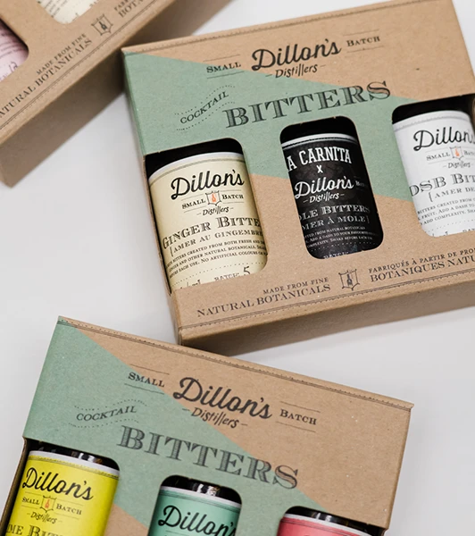 Dillon's small batch cocktail bitters trio in custom paper boxes, showcasing Ingersoll Paper Box's quality food and beverage packaging.