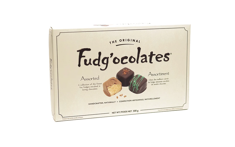 Box of The Original Fudg'ocolates' displaying an assortment of gourmet fudges enrobed in chocolate, indicating handcrafted, natural confectionery.